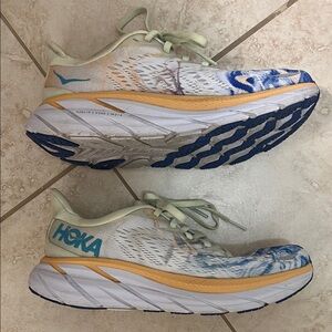 Hoka Athletic Shoes with Blue and Orange Highlights